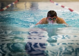 Senior Ben Andersen swimming during a competition. 