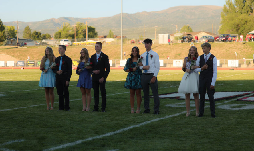 Homecoming royalty escorted on the field